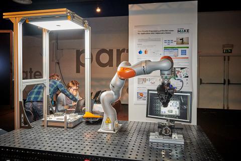 kuka cobot demo op Symposium Flanders Make